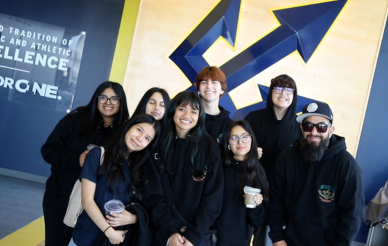 Group in front of triton sign